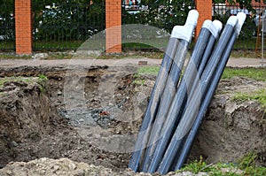 Laying of underground communication cables in a dug-out ditch