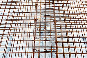 laying the welded mesh on a construction site before pouring the concrete