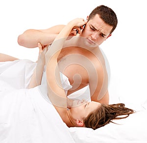 Laying woman taking phone from man