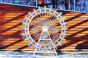 Layout ferris wheel on a wooden background with free space