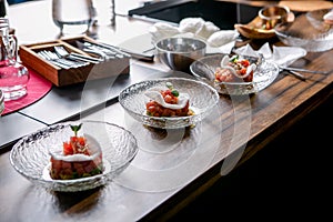 The layout of the finished dish. Tuna tartar on a plate. Master class in the kitchen. The process of cooking. Step by step.