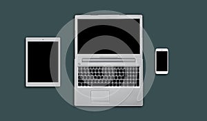 Layout of modern gadgets for web design. Top view of electonic devices: tablet, laptop computer and mobile phone. Office workplace