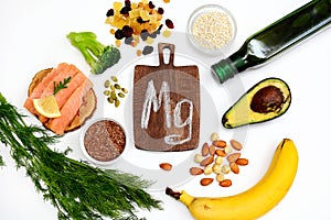 Layout of products animal and vegetable sources of magnesium on a white background. The concept of a balanced diet. View