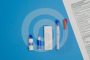 Layout: rapid test for antibodies to coronavirus, questionnaire, lancet on a blue background.