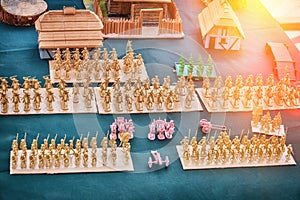 The layout of the Russian-Swedish war of small houses and toy soldiers. Soldier in a uniform of a Swedish army of the 18th century