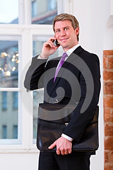 Laywer or Businessperson in Office on the phone