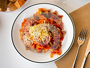 Lazos con tomate, spanish pasta in tomato sauce photo