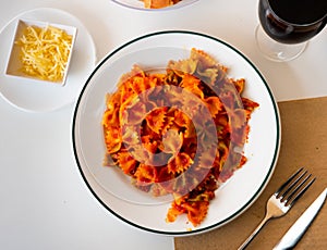 Lazos con tomate, spanish pasta in tomato sauce photo