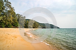 Lazy Beach on Koh Rong Samloem tropical Island at sunny summer day with beautiful blue sky. Cambodia, asia photo