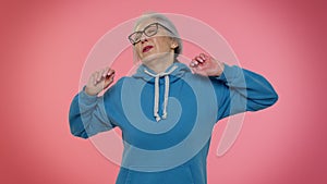 Lazy elderly woman yawning, sleepy inattentive feeling somnolent bored, suffering from lack of sleep