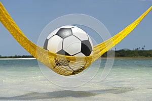 Lazy Football Soccer Ball Relaxing in Beach Hammock