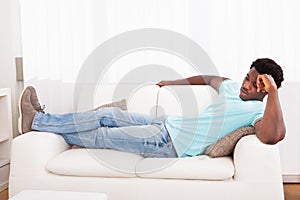 Lazy man chilling out on sofa