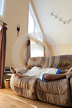 Lazy Man Laying on the Sofa photo