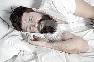 Lazy morning. Relax and sleep concept. Man bearded guy sleep on white sheets. Healthy sleep and wellbeing. Man bearded