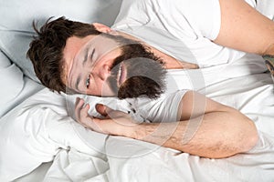 Lazy morning. Relax and sleep concept. Man bearded guy sleep on white sheets. Healthy sleep and wellbeing. Man bearded photo