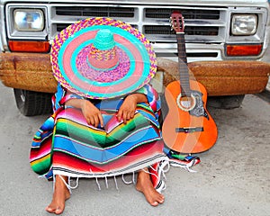 Lazy nap mexican guy sleeping on grunge car