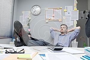 Lazy office worker feet up photo