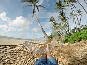 Lazy time. Man in a hammock on a summer day