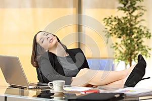 Lazy or tired businesswoman sleeping at work