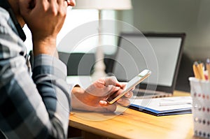 Lazy worker using phone in office avoiding work