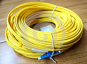 LC-LC duplex single mode PatchCord/Fiber Optic Patch cord in one roll on a vinyl floor
