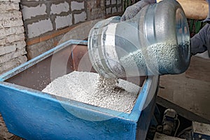 LDPE or HDPE plastic granules are poured into the extruder