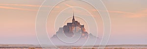 Le Mont Saint Michel in Normandy, France at sunrise