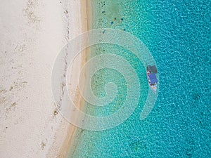 Le Morne beach Mauritius,Tropical beach with palm trees and white sand blue ocean and beach beds with umbrella,Sun