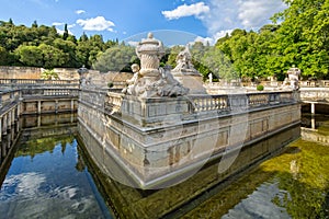 Detail of the beautiful fountain in the Jardin de la Fontaine in Nimes photo