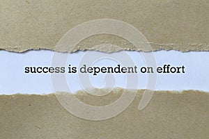 Success is dependent on effort on white paper photo