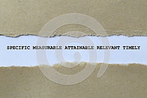 specific measurable attainable relevant timely on white paper photo