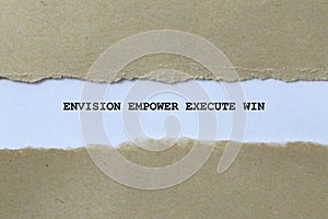 envision empower execute win on white paper photo