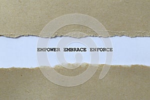 empower embrace enforce on white paper photo