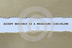 accept hardship as a necessary discipline on white paper photo