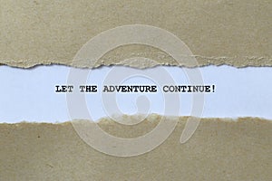 let the adventure continue on white paper photo