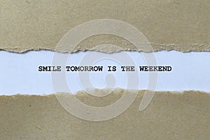 smile tomorrow is the weekend on white paper photo