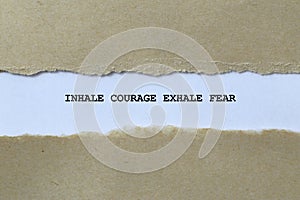 inhale courage exhale fear on white paper photo