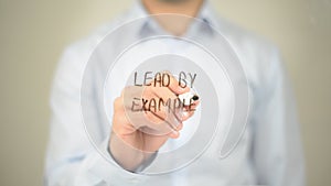 Lead by Example , Man writing on transparent screen