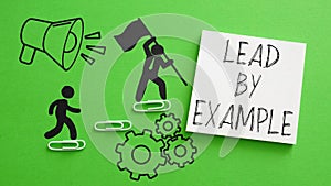 Lead By Example is shown using the text