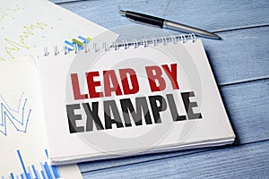 lead by example text on card, concept background