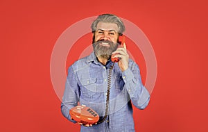 Lead generation specialist. Sales script. Bearded man phone conversation. Retro phone. Outdated technology. Manager