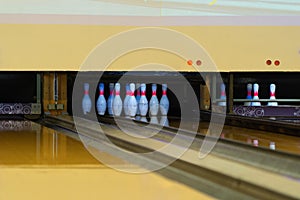 Lead machine bowling pinsetter and lane sport community center activity recreation indoor game lifestyle. Target score in