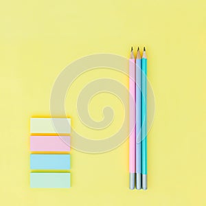 lead pencil and sticky notes on yellow paper background