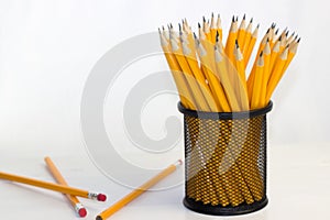 lead pencils in metal cup isolated on white