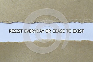resist everyday or cease to exist on white paper photo