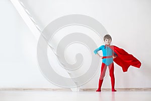 Leader. The boy super hero in a red cloak.