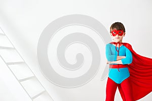 Leader. The boy super hero in a red cloak.