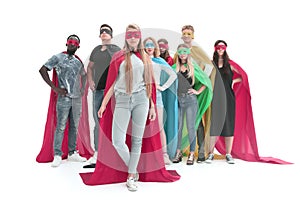 Leader and a group of young men in a variety of superhero cloaks
