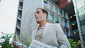 Leader person eating lunch on go architecture place closeup. Latin man hurrying