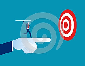 Leader pointing to target with colleague throwing the arrow as symbol of finding success